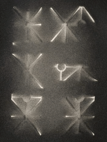 A grayscale image presenting six geometric, abstract shapes reminiscent of origami or folded paper, arranged in two columns against a dark background. The shapes exhibit sharp lines and subtly glowing edges, capturing the refined aesthetic of Folio Series 1 and its exclusive limited editions available through an art subscription.