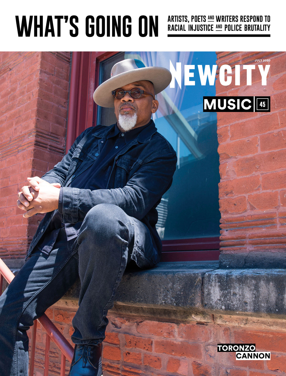 A man in a wide-brimmed hat and sunglasses sits on a brick windowsill, embodying the soulful spirit of Chicago music, on the cover of the July 2020 Issue: Music 45. The magazine features bold text reading “WHAT’S GOING ON” and “NEWCITY MUSIC,” with his name, Toronzo Cannon, displayed at the bottom.