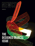Cover of "December 2017: The Designed Objects Issue" features colorful, translucent, abstract shapes overlapping on a black background, capturing the innovative spirit of designed objects, with the text "THE DESIGNED OBJECTS ISSUE" in bold white letters at the bottom.