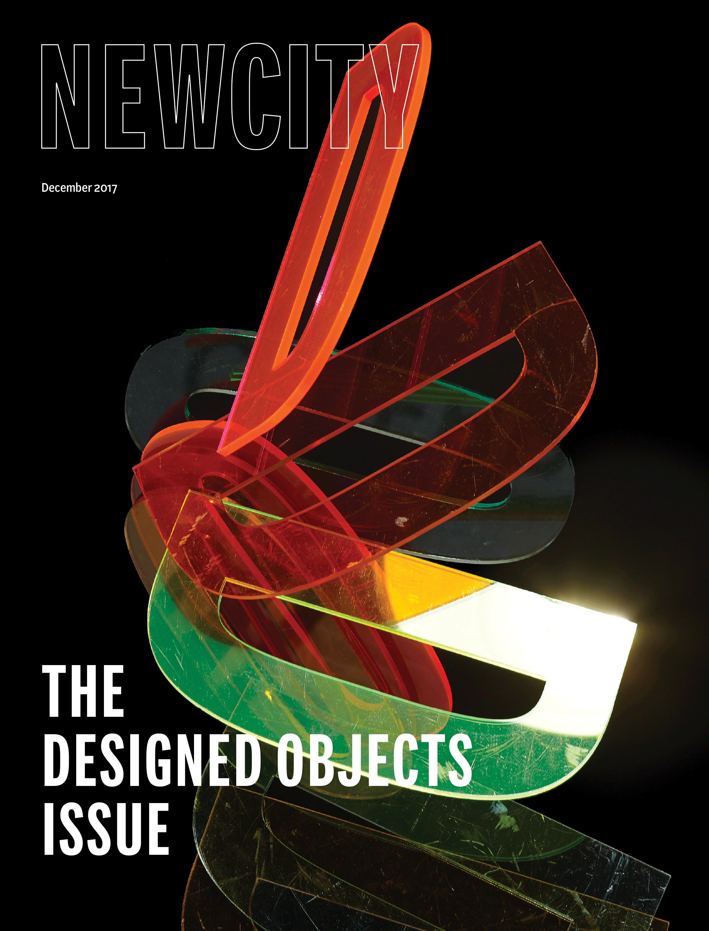 Cover of "December 2017: The Designed Objects Issue" features colorful, translucent, abstract shapes overlapping on a black background, capturing the innovative spirit of designed objects, with the text "THE DESIGNED OBJECTS ISSUE" in bold white letters at the bottom.